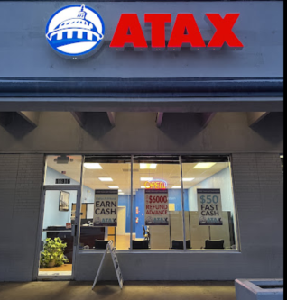 ATAX bilingual tax office storefront with full eagle signage — selected through the ATAX site-selection playbook